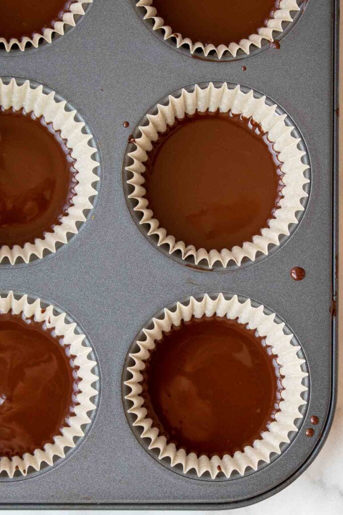Prepared chocolate peanut butter cups ready for the freezer