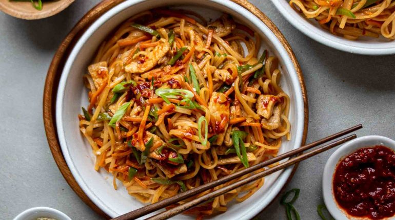 chili paste cooking instructions dietary adaptations Easy Easy Meal Flavorful Gluten-Free healthy healthy dinner Honey ingredients low-sodium meal prep nutrition Pork Noodle Stir-Fry protein Quick quick recipe Recipe reheating soy sauce Spicy Pork Noodles storage Vegetables Versatile 