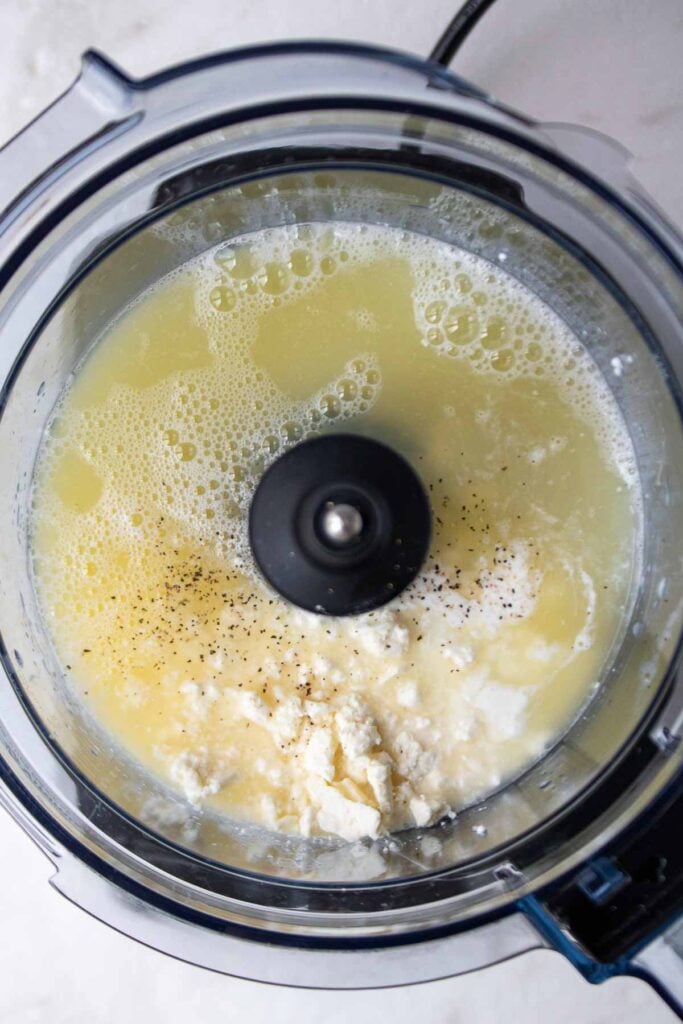 Liquid egg whites, cottage cheese, Monterey jack cheese, feta cheese, and cornstarch in a food processor.