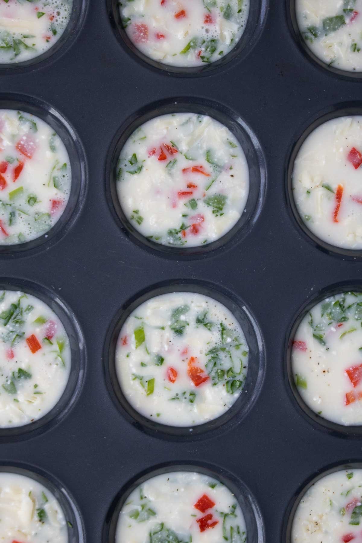 Egg white mixture in a muffin tin.