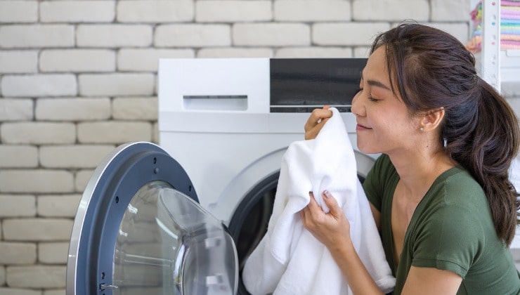 Woman smelling scented towels