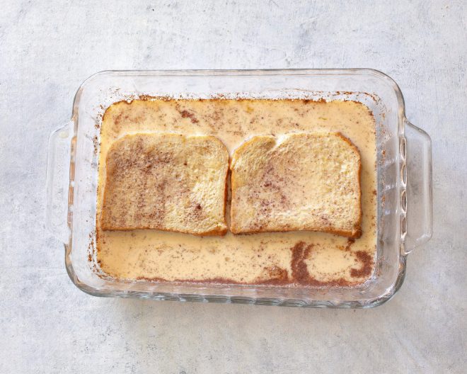 soaked bread in a baking dish