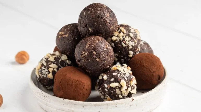 adults alcohol-free version. Chocolate chopped nuts Christmas baking cocoa powder confectioners sugar dessert family freezing friends gift Honey ingredients no-bake Pecans Recipe rum balls shredded coconut spiced rum sprinkles storage tempered chocolate vanilla variation 