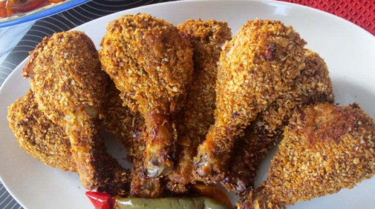 coating ingredients cooking instructions cornflakes crushed tortilla chips happy cooking Oven Fried Chicken oven temperatures panko breadcrumbs skin-on chicken drumsticks sour cream mixture Spices 