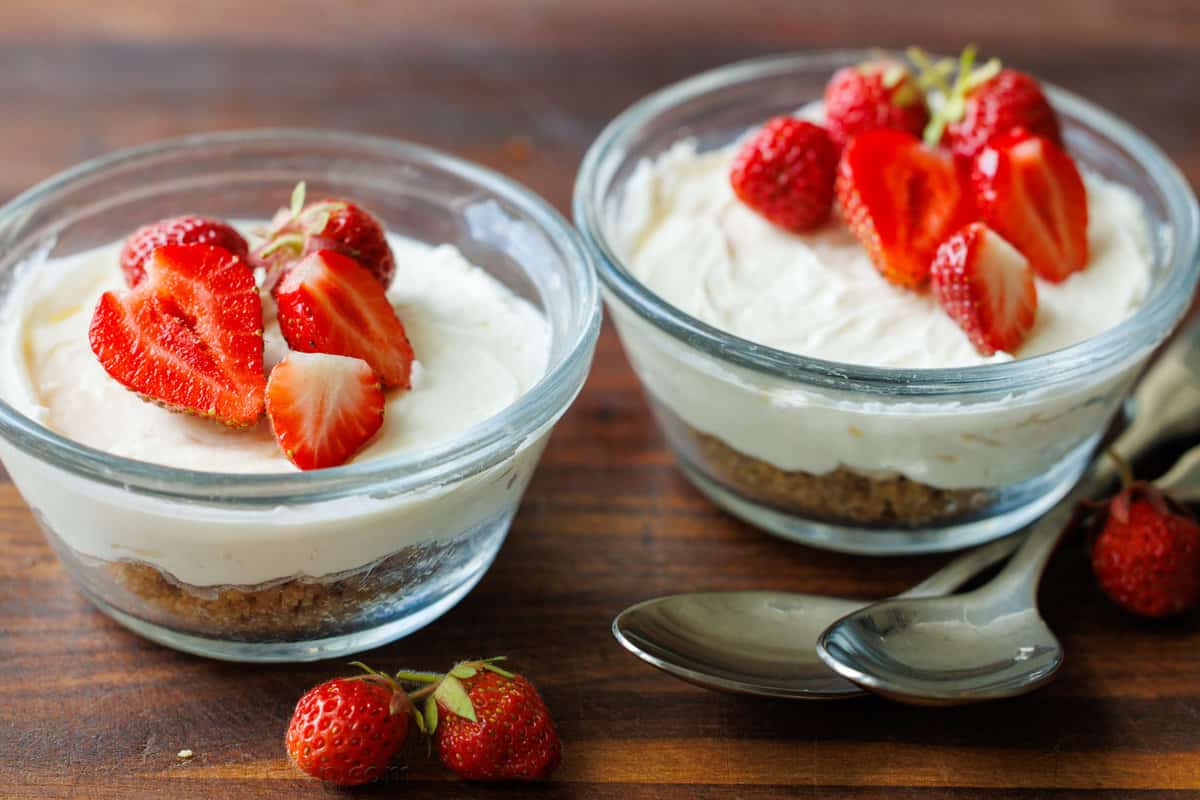 No-Bake Mini Cheesecakes Served in Glass Ramekins with Strawberry Topping