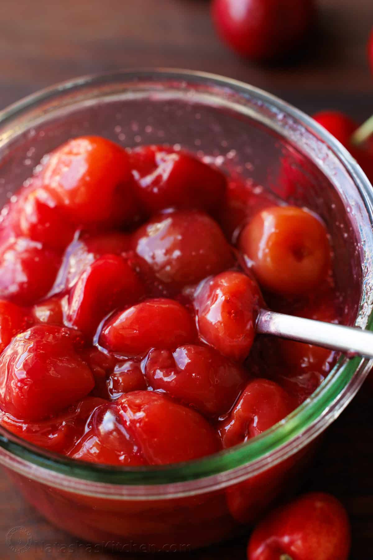 Homemade cherry topping in a glass bowl