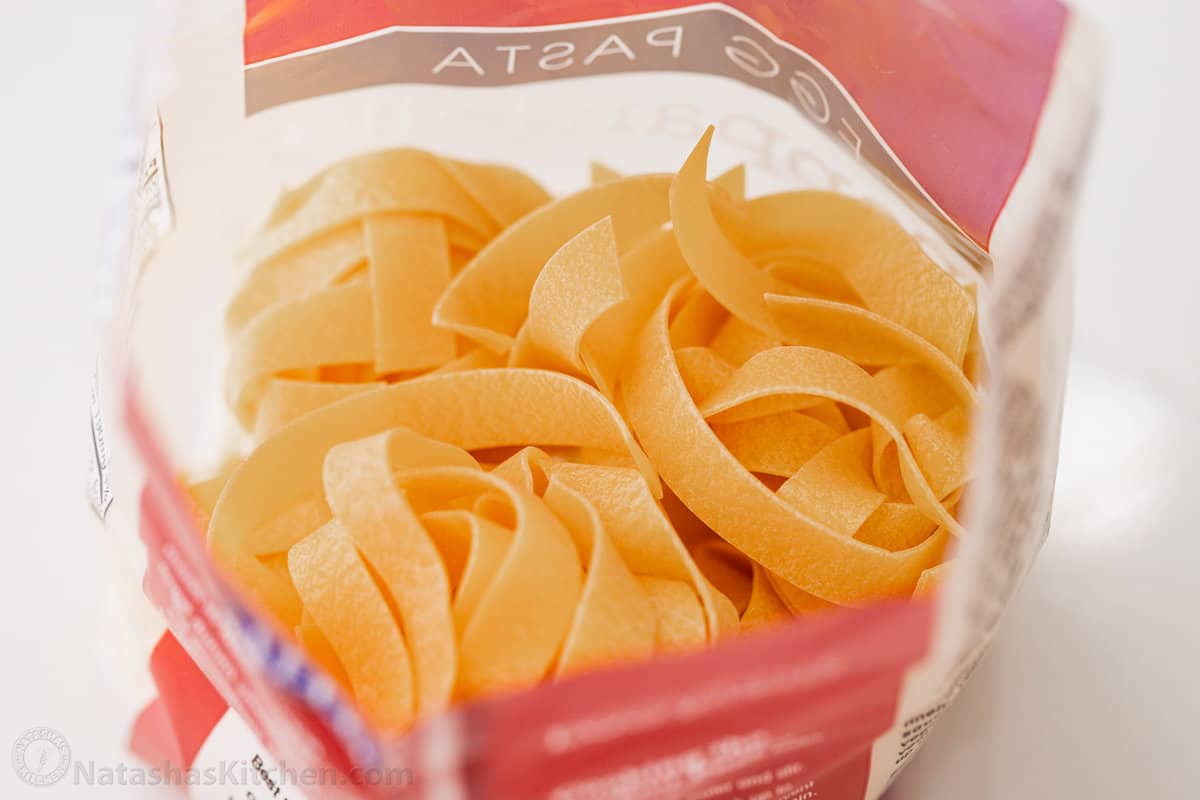 Close up of pappardelle pasta in a bag.