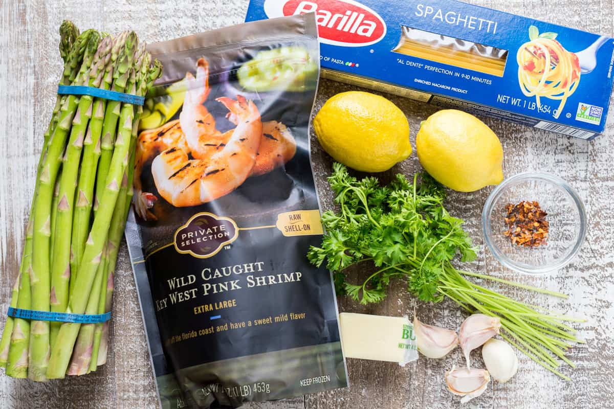 Ingredients for shrimp scampi with pasta and asparagus