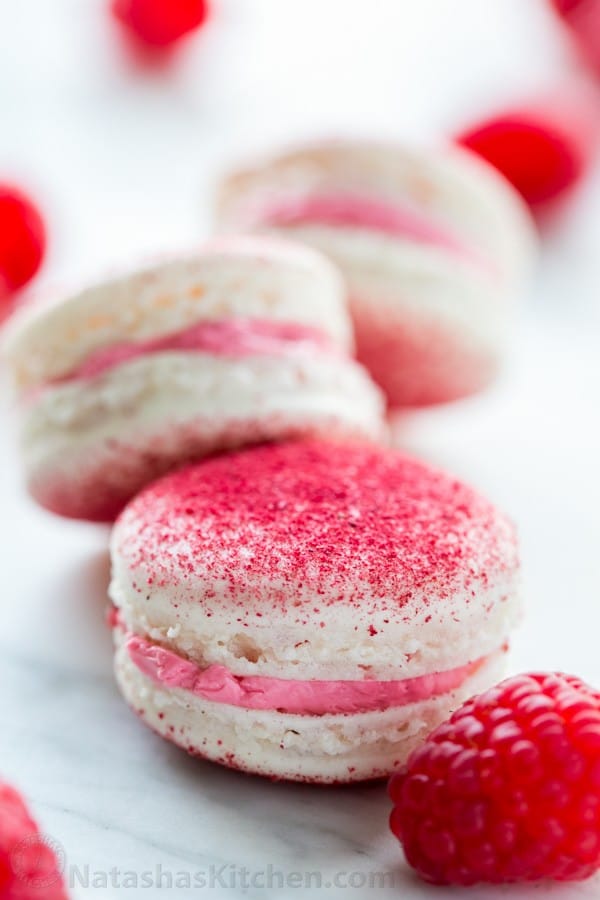 These raspberry macarons are tangy, sweet, and melt-in-your-mouth amazing! Watch this great step-by-step video recipe from natashaskitchen.com