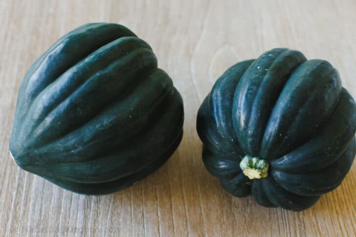 Two acorn squash on a table