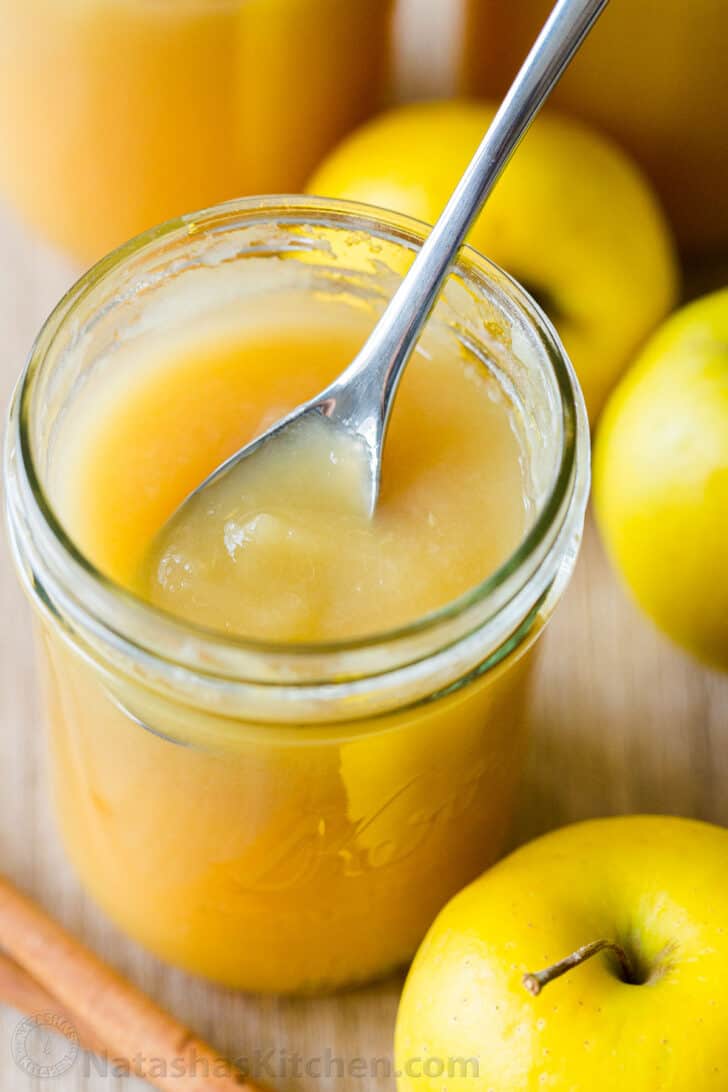 Smooth and Chunky applesauce in jar with spoon