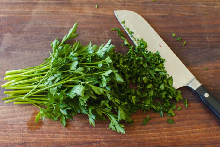 Flat leaf parsley chopped with a knife