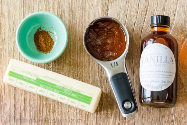 Ingredients for honey butter recipe with unsalted butter, honey, vanilla and cinnamon