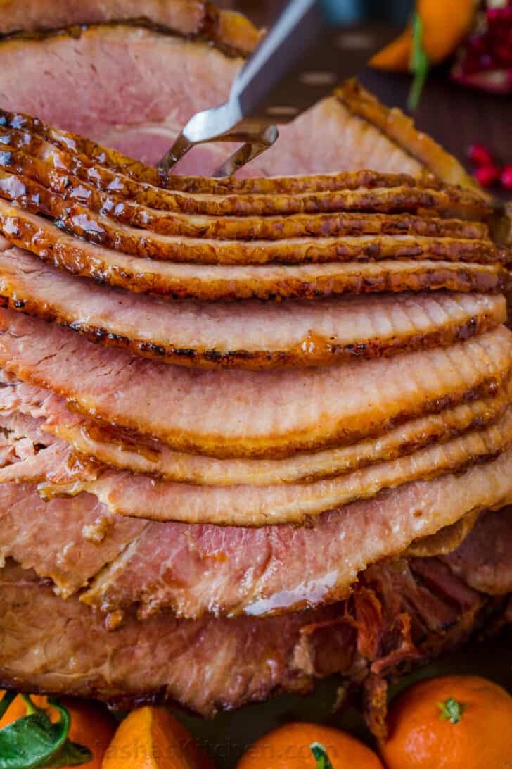 The perfect baked ham spiral sliced on a platter