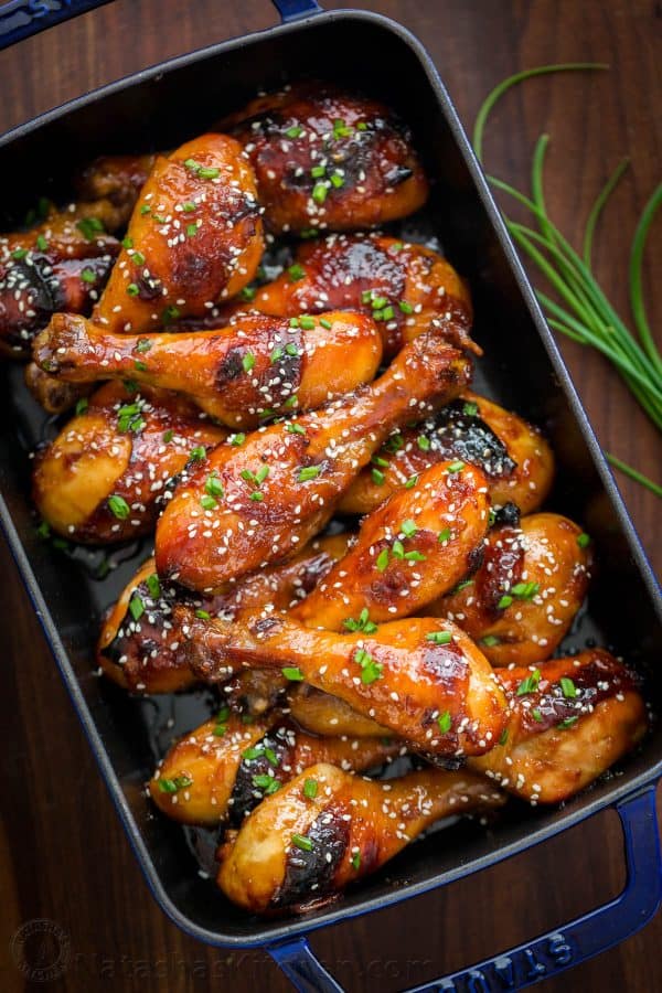 These baked honey glazed chicken drumsticks are finger-lickin' good! The honey-soy glaze makes these juicy chicken drumsticks so flavorful and irresistible | natashaskitchen.com