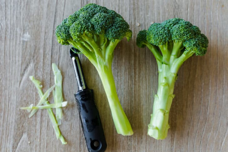 Peeled fresh broccoli with stems to use in broccoli and cheese soup