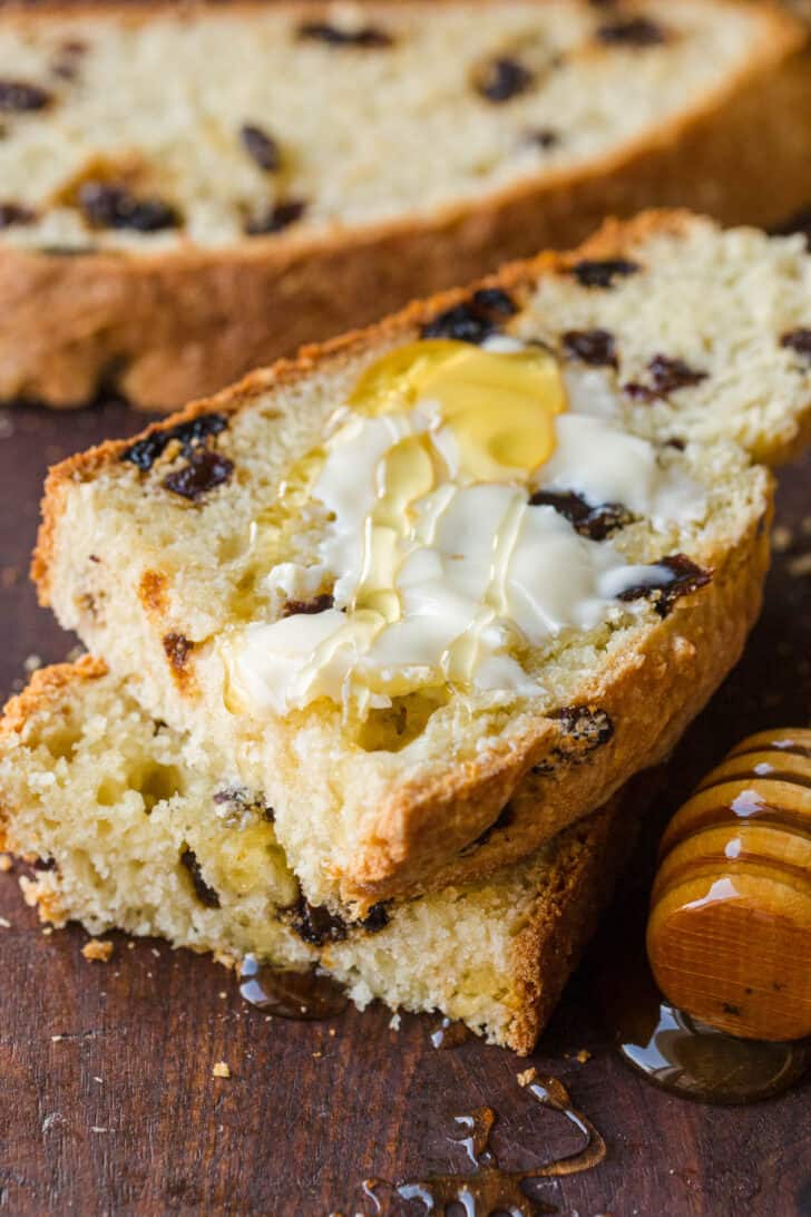 Sliced soda bread with butter and honey