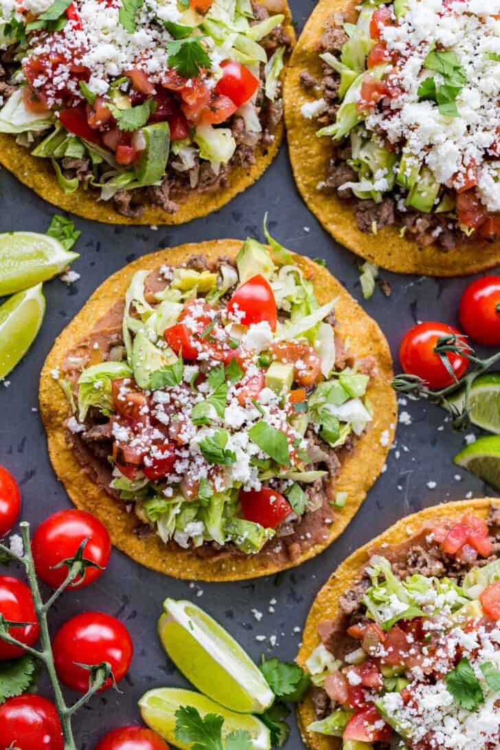 Tostadas served with toppings on a platter