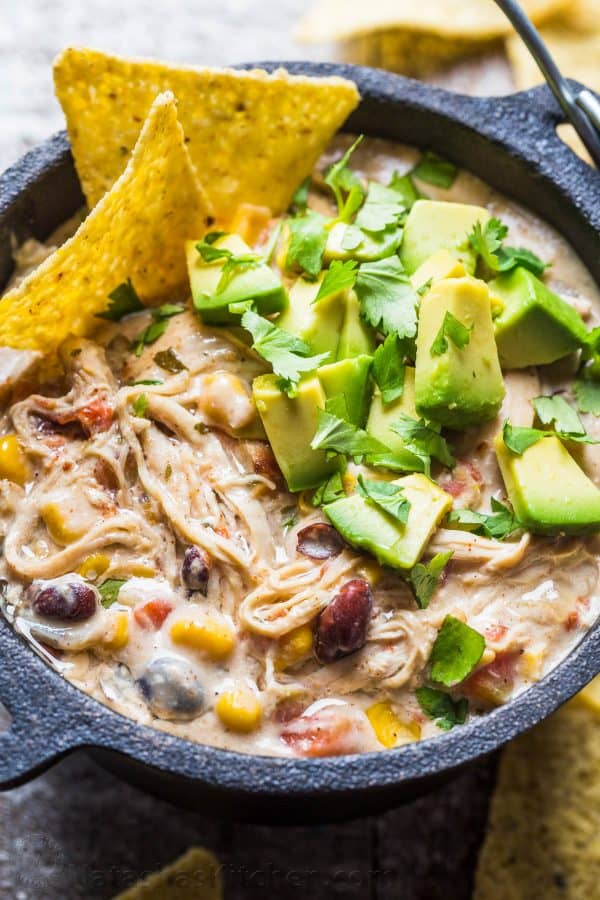 Instant Pot White Chicken Chili recipe garnished with avocado and cilantro