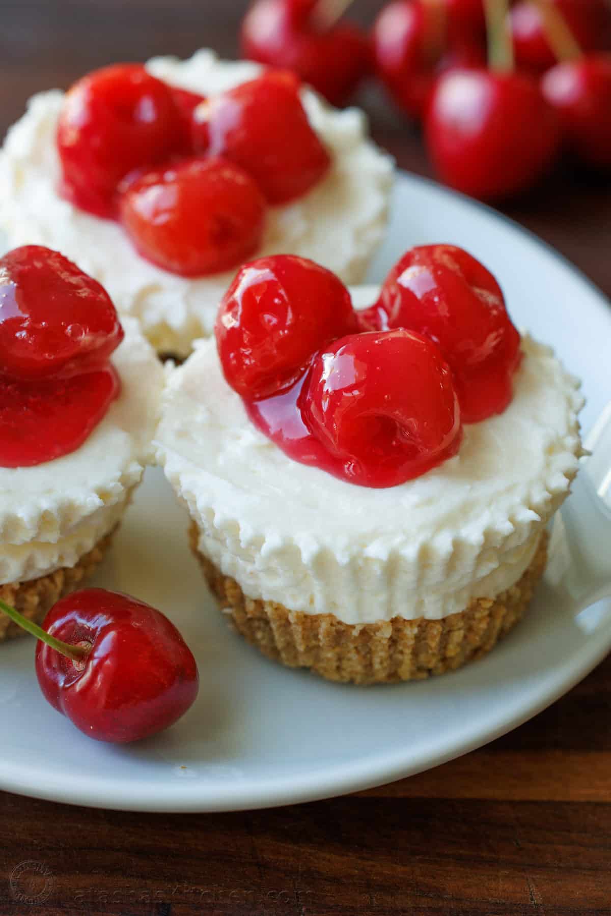 No-Bake Mini Cheesecakes with Cherry Topping on a Plate