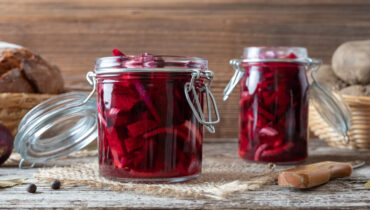 Fermented beet kvass in two glass jars